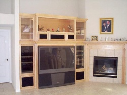 The entertainment center and mantel flow together