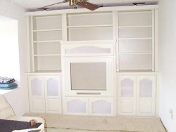 Arched doors with grill cloth highlight this unit