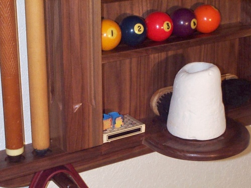 The hand chalk shelf is machined to help keep loose chalk from falling on the floor.  A peg fits up the center hole in the chalk cone.