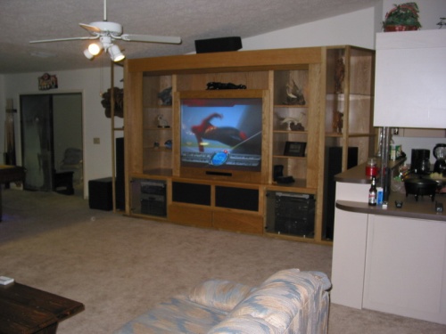 It is the focal point in a huge great room.  The facade in front of the TV is easily removed for access.