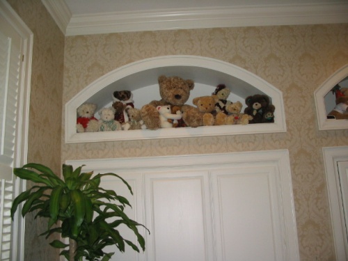 Arched display areas were cut in above the existing closets.