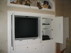 Pocket doors hide the flat screen TV.