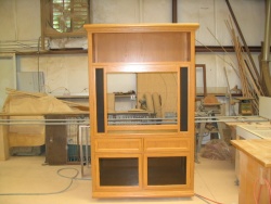 This custom cabinet was ordered when the purchase of a larger TV made the original cabinet obsolete.
