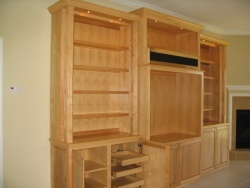 The full columns hold up the "light board".  Moving the lights out allows for better illumination of the whole bookcase and the columns are striking.