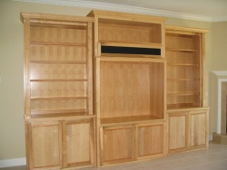 Highlight for Album: This TV center/bookcase is made of stained maple.