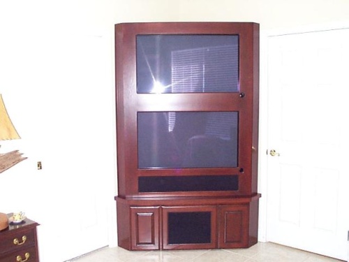 This Cherry corner unit is on casters and is home to a pair of Plasma TVs and equipment.

JS - Ocala